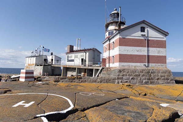 Picture of Märket (Åland Islands): Buildings on Märket with the lighthouse on the right