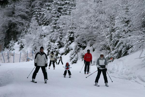 Skiing down a slope of the St. Johann ski area | St. Johann Skiing | Austria