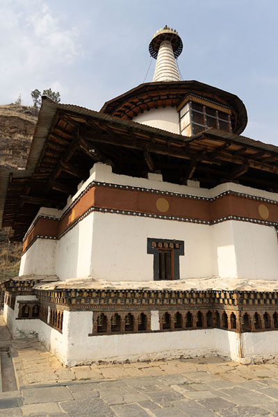Picture of Dumtseg Lhakhang (Bhutan): The whitewashed building of Dumtseg Lhakhang with prayer wheels
