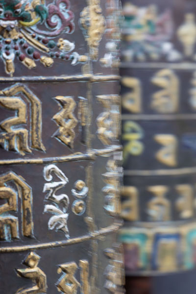 Foto de Colourful prayer wheels at Jambay LhakhangJambay Lhakhang - ButÃ¡n