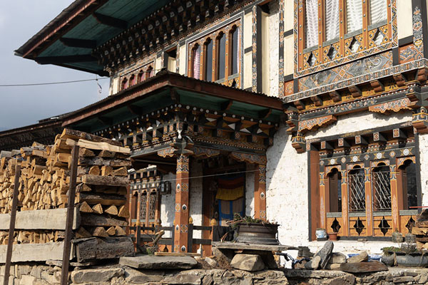 Foto van Traditional house with stack of wooden logs for cold days in UraUra - Bhutan