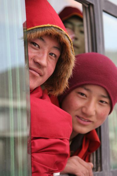 Monks in a bus to Trangu monastery | Jyekundo faces | China