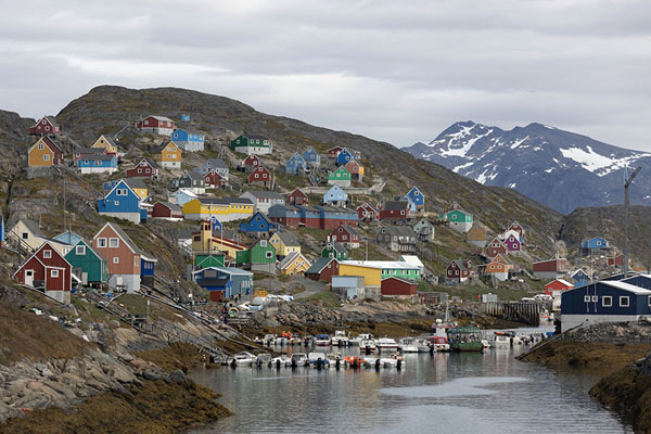 The tiny port and settlement of Kangaamiut with snow-capped mountains in the background | Kangaamiut | Greenland