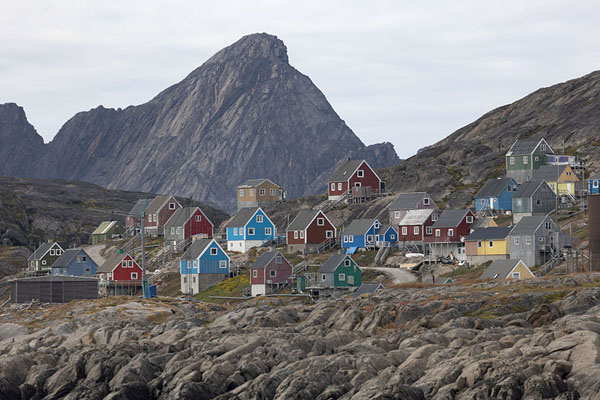 Picture of Brightly painted houses on rocks: looking up at Kangaamiut - Greenland - Europe