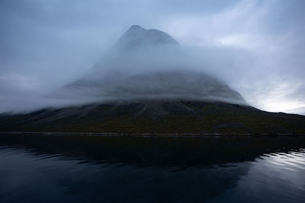 Picture of Nuuk fjord (Greenland): Dusk in Nuup Kangerlua with clouds swirling around mountains