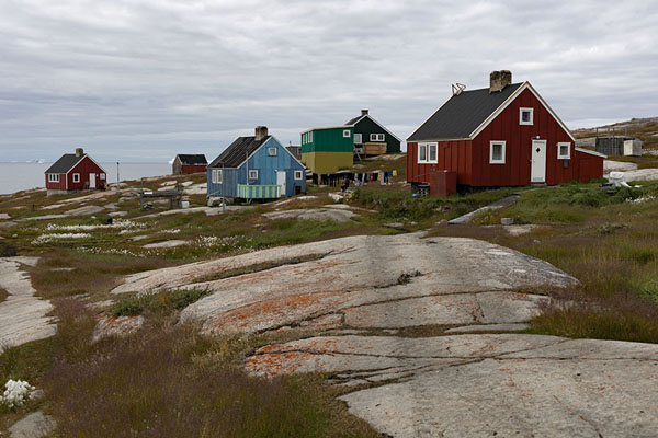 Foto di Colourful houses on rocks, typical view of OqaatsutOqaatsut - 