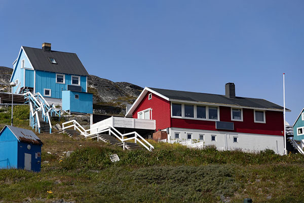 Picture of Paamiut (Greenland): Looking up a rocky hill with red and blue houses in Paamiut