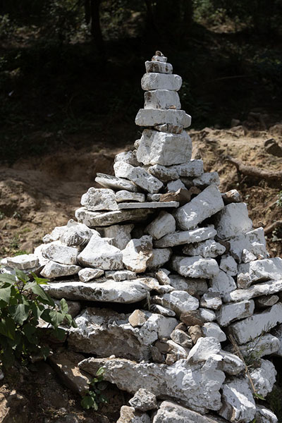 Foto van Pile of white stones along the kora circuitDharamshala - India