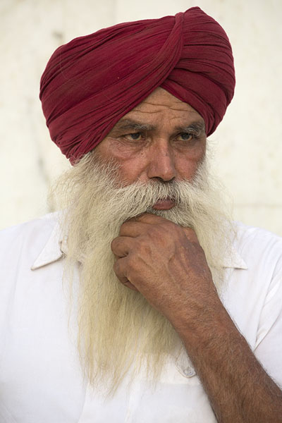 Indian Sikh with red turban and white shirt | Gurudwara Bangla Sahib | India