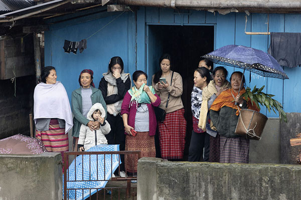 Foto van Women of several generations gathering outside a house in Hija village to watch the Myoko procession passing byHija - India
