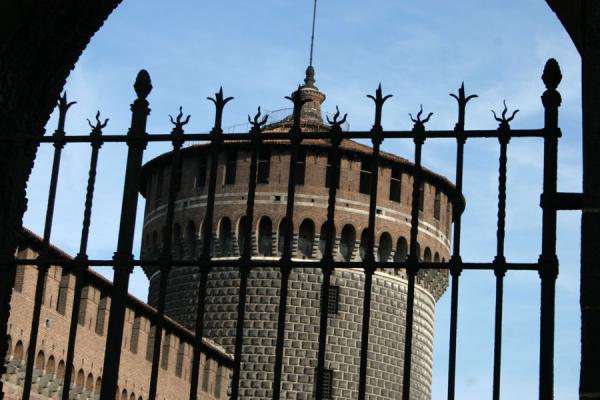 One of the round towers seen through an iron gate | Castello Sforzesco | Italy