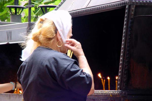 Picture of Bucharest churches (Romania): Burning candle at church, Bucharest