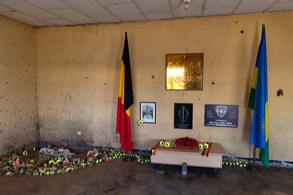 Picture of Belgian Peacekeepers memorial (Rwanda): The Belgian commanders were killed in the corner of this room, with plaque and flags