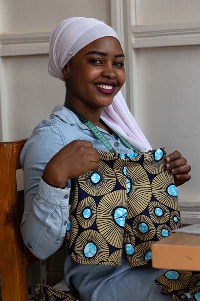 Picture of Nyamirambo community (Rwanda): Woman showing her work in a workshop in Nyamirambo