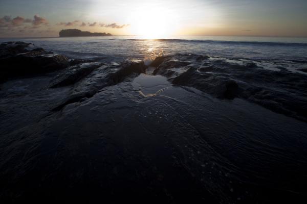 Picture of Namua island (Samoa): Sun rising over the slippery rocks east of Namua island, the very first sunrise of the planet