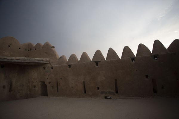Crenellated wall of the defensive tower above Al-Hayl Fort | Al-Hayl Fort | United Arab Emirates