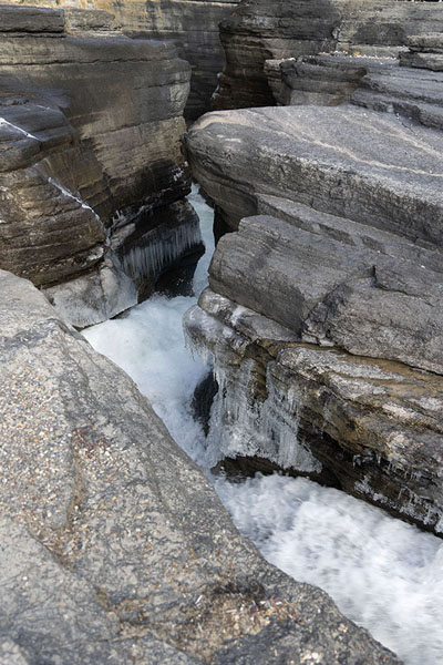 Picture of Jasper Banff National Parks (Canada): Mistaya Canyon with water rushing through ice-covered rocks